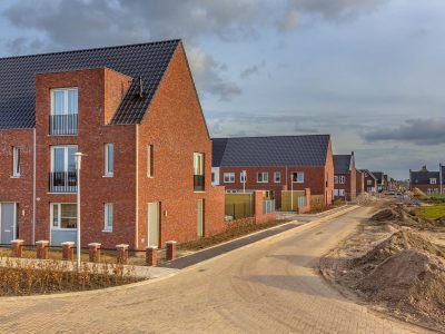 Newly built houses in modern street building site in suburb of city in the Netherlands